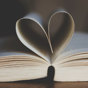 open book with pages shaped into a heart